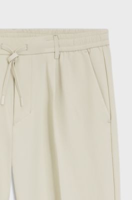 Pantaloni attivi con fit affusolato in tessuto elasticizzato idrorepellente, Beige chiaro