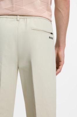 Pantaloni attivi con fit affusolato in tessuto elasticizzato idrorepellente, Beige chiaro