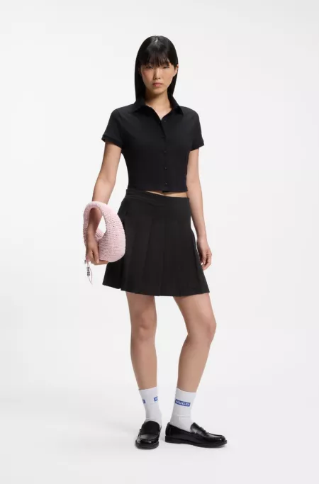 Pleated skirt in stretch cotton with integrated shorts
