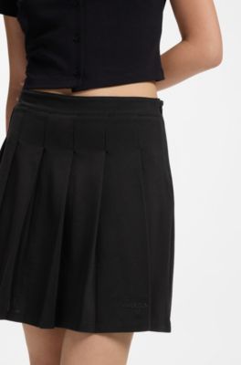 Gonna a pieghe in cotone elasticizzato con shorts integrati, Nero