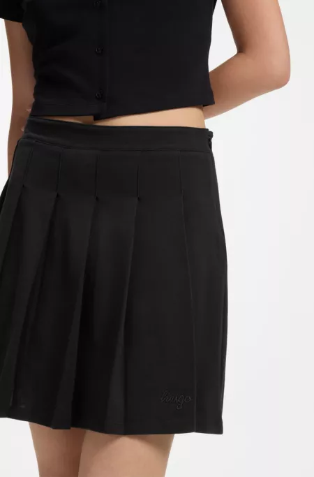 Pleated skirt in stretch cotton with integrated shorts