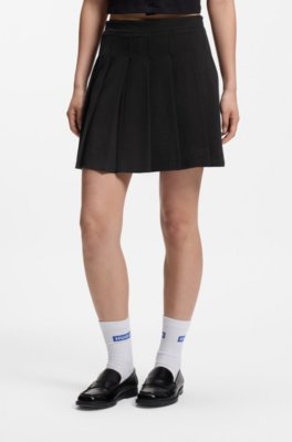 Pleated skirt in stretch cotton with integrated shorts