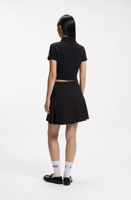 Pleated skirt in stretch cotton with integrated shorts