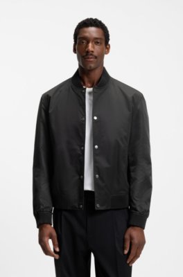 Water-repellent jacket with monogram-pattern sleeves