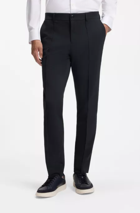 Pantalones slim fit de tejido elástico técnico