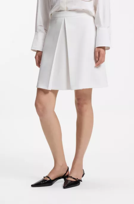 Pleated A-line mini skirt in stretch fabric