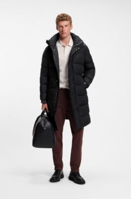 Long-length water-repellent puffer jacket with concealed closure, Black