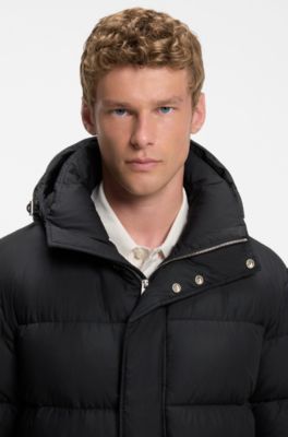 Long-length water-repellent puffer jacket with concealed closure, Black