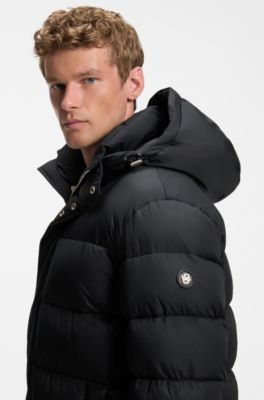Long-length water-repellent puffer jacket with concealed closure, Black