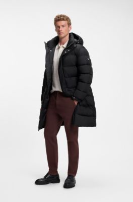 Long-length water-repellent puffer jacket with concealed closure, Black