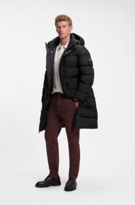 Long-length water-repellent puffer jacket with concealed closure