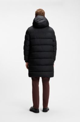 Long-length water-repellent puffer jacket with concealed closure, Black