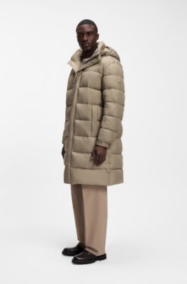 Long-length water-repellent puffer jacket with concealed closure