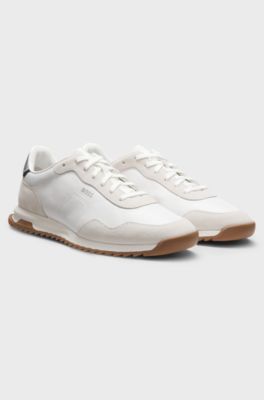 Mixed-material trainers with textured fabric, White