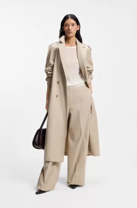 Knitted cardigan with rear button closure