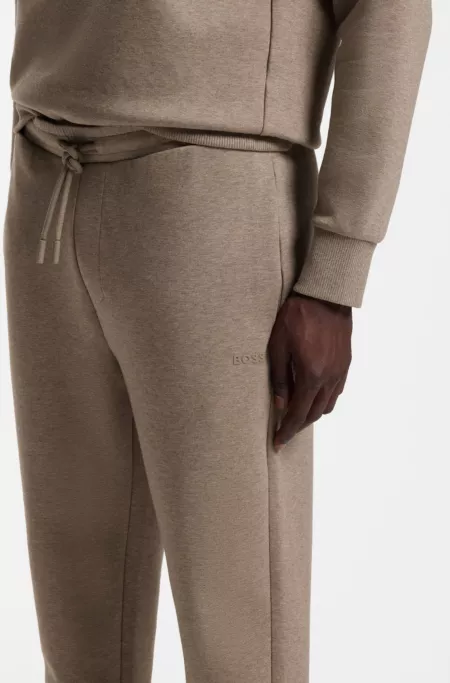 Bas de survêtement en coton stretch à logo en relief
