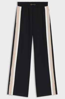 Tracksuit bottoms with contrast-stripe side seams, Black