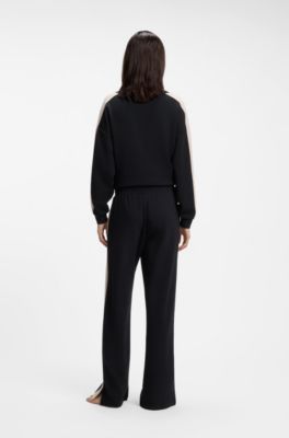 Tracksuit bottoms with contrast-stripe side seams, Black
