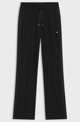 Tracksuit bottoms in stretch modal with monogram tape, Black