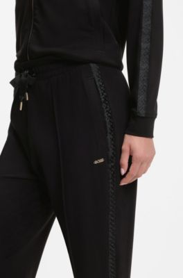 Tracksuit bottoms in stretch modal with monogram tape, Black