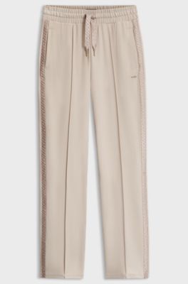 Tracksuit bottoms in stretch modal with monogram tape, Light Beige