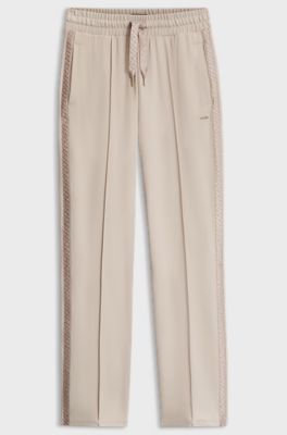 Trainingsbroek van stretchmodal met monogramband, Lichtbeige