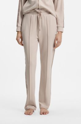 Trainingsbroek van stretchmodal met monogramband, Lichtbeige