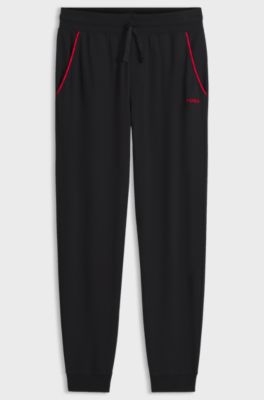 Cotton-blend cuffed tracksuit bottoms with logo piping, Black