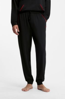 Cotton-blend cuffed tracksuit bottoms with logo piping, Black