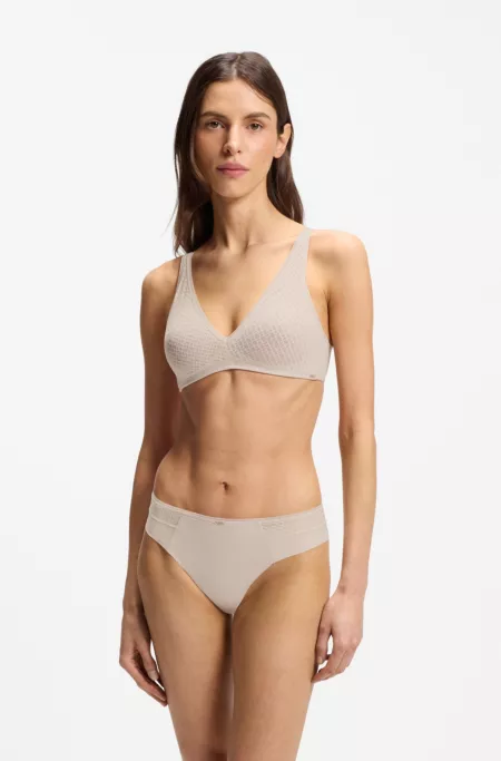 Slip taille basse avec plaquette dorée et dentelle monogramme