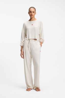 Stretch-modal tracksuit bottoms with heart logo, Natural