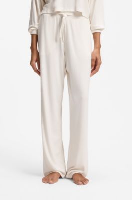 Stretch-modal tracksuit bottoms with heart logo, Natural