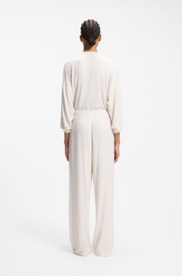 Stretch-modal tracksuit bottoms with heart logo, Natural