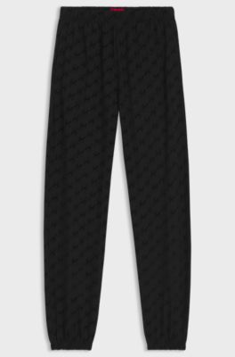 Relaxed-fit tracksuit bottoms with flocked-logo print, Black