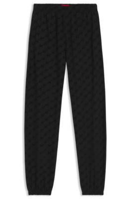 Relaxed-fit tracksuit bottoms with flocked-logo print 1