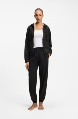 Relaxed-fit tracksuit bottoms with flocked-logo print, Black