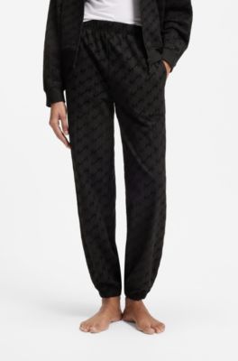 Relaxed-fit tracksuit bottoms with flocked-logo print, Black