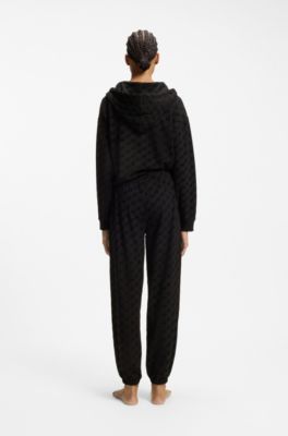 Relaxed-fit tracksuit bottoms with flocked-logo print, Black