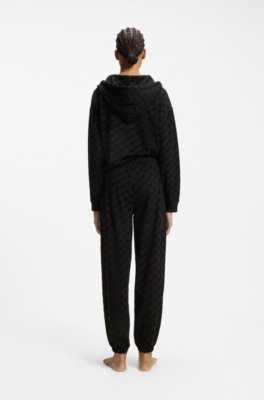 Relaxed-fit tracksuit bottoms with flocked-logo print 3