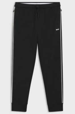 Triangle-jacquard tracksuit bottoms with rubberised logo, Black