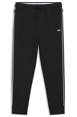 Triangle-jacquard tracksuit bottoms with rubberised logo 1