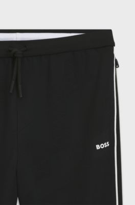 Triangle-jacquard tracksuit bottoms with rubberised logo, Black