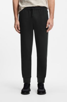 Triangle-jacquard tracksuit bottoms with rubberised logo, Black