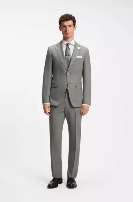 Pantalones slim fit de tejido elástico jaspeado