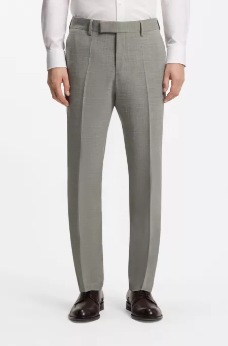Pantalones slim fit de tejido elástico jaspeado