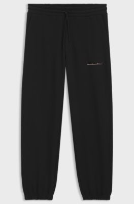Relaxed-fit cotton trousers with streetwear logo, Black