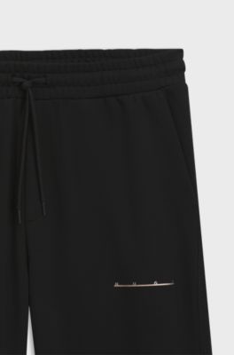 Relaxed-fit cotton trousers with streetwear logo, Black