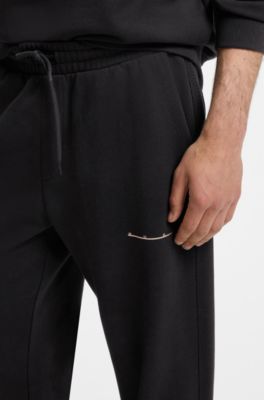 Relaxed-fit cotton trousers with streetwear logo, Black