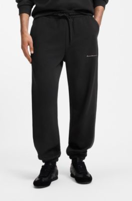 Relaxed-fit cotton trousers with streetwear logo, Black