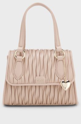 Faux-leather handbag with heart charm, light pink